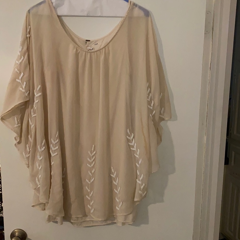 Free people beige silky mini dress with Devon detail. Light beige